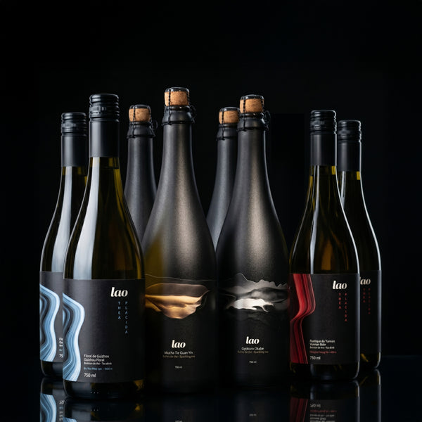 Grand Tasting Box Lao 8 bottles award-winning sparkling teas black background